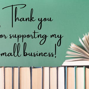 May include: Image features a stack of books with an open book on top, and the text "Thank you for supporting my small business!" written in cursive. The background is a solid teal color.
