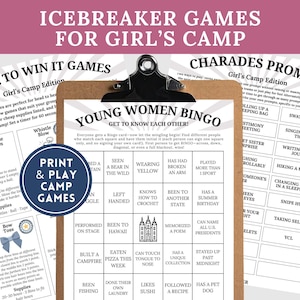 May include: A clipboard with printed game sheets for a girl's camp, including "Minute to Win It Games" and "Charades Prompts." A navy blue circle reads "Print & Play Camp Games."