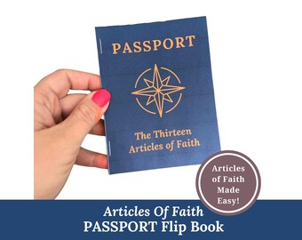 Puede incluir: Un folleto tipo pasaporte azul marino con la palabra "PASSPORT" en letras doradas. La portada presenta un diseño de rosa de los vientos dorada y el texto "The Thirteen Articles of Faith". El folleto está sostenido por una mano con esmalte de uñas rosa.