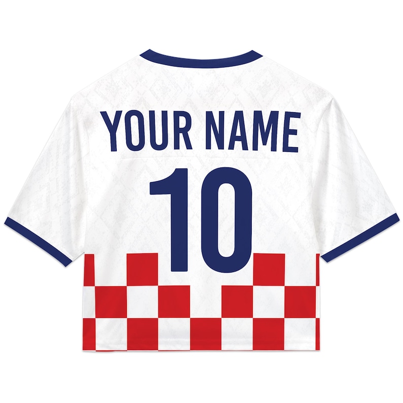 May include: White cropped soccer jersey with blue trim and the text "YOUR NAME" above the number "10" in blue. The bottom of the jersey features a red and white checkered pattern.