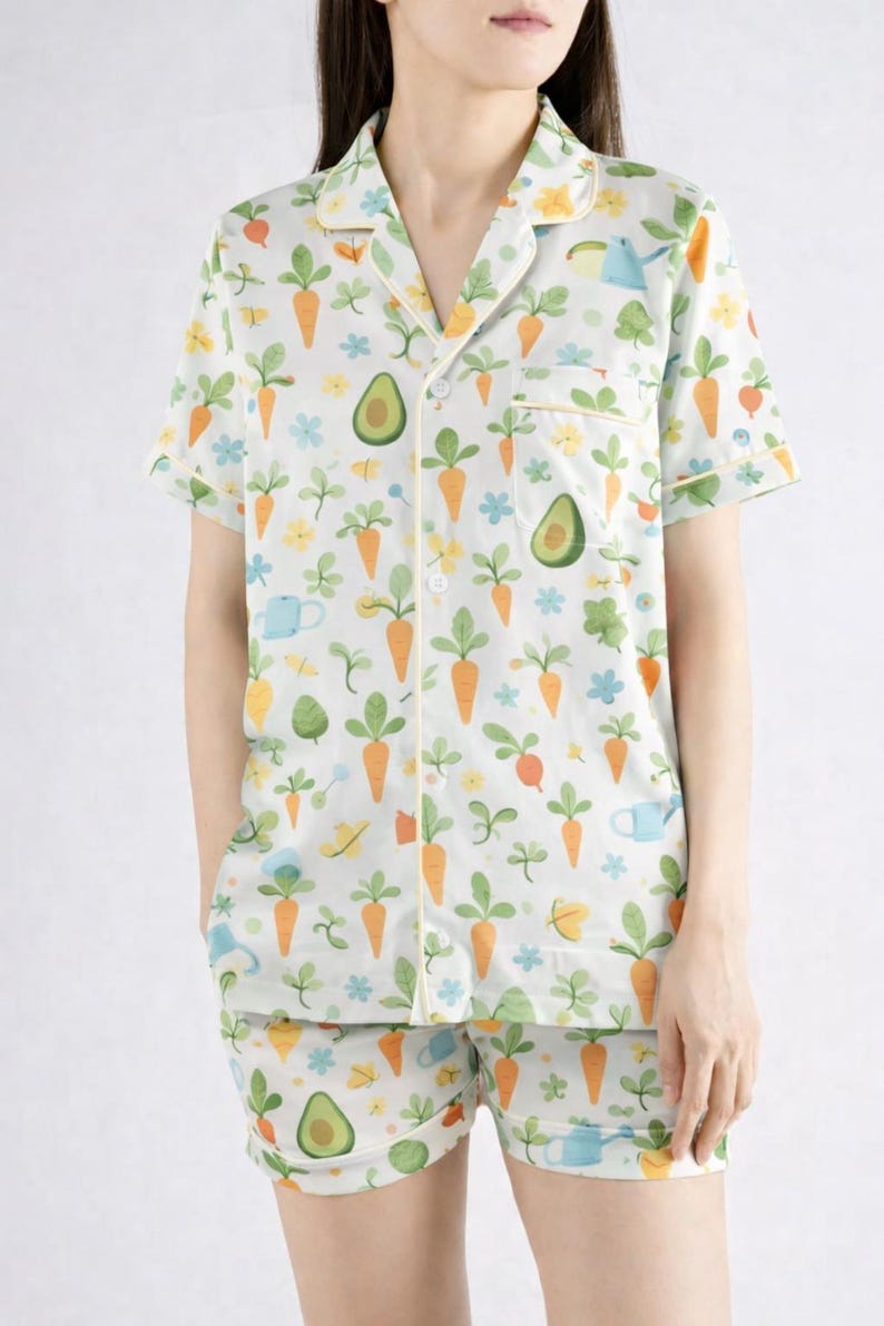 May include: A white ceramic mug with a black handle and the text "But First, Coffee" in a black, bold font. The mug is on a white surface.