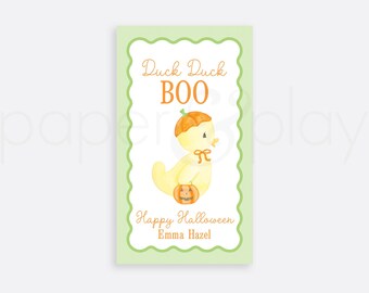 May include: A light green rectangular card with a scalloped border features a watercolor illustration of a yellow duck wearing a pumpkin hat and holding a jack-o'-lantern. The text reads "Duck Duck BOO" and "Happy Halloween Emma Hazel".