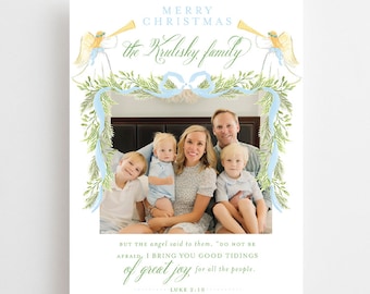 May include: A Christmas card featuring a family portrait with a festive wreath and angels. The text reads "Merry Christmas the Krulishky family" and "But the angel said to them, "Do not be afraid, I bring you good tidings of great joy, for all the people." Luke 2:10"