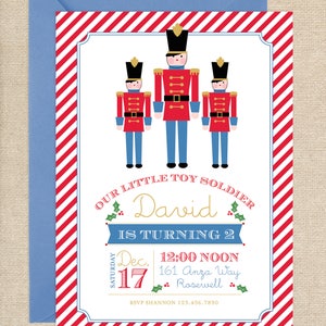 May include: A red and white striped invitation with a blue border. The invitation is for a birthday party for a boy named David who is turning two. The invitation features three toy soldiers in red, blue, and gold. The text on the invitation reads "Our Little Toy Soldier David is Turning 2" and includes the date, time, and address of the party. RSVP information is also included.