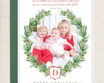 May include: A Christmas card featuring a wreath with a photo of a family of five children. The card has a red and green color scheme and includes the text "The LORD has done GREAT THINGS for us, and we are FILLED with JOY. PSALM 126:3" and "MERRY CHRISTMAS..... THE DIEHL FAMILY ALICE ANNE, JOSH, LILLY, HENRY AND JOHN CECIL."