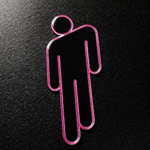 Könnte beinhalten: Eine schwarze Figur mit rosa Umriss, die eine Person darstellt, vor einem dunklen Hintergrund. Das Design ist minimalistisch, mit einem kreisförmigen Kopf und geraden Linien für Körper und Gliedmaßen. Der rosa Umriss setzt einen Farbakzent.