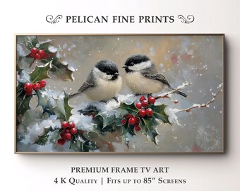 May include: A framed painting featuring two small birds perched on a snowy branch with holly and red berries. The artwork is labeled "PELICAN FINE PRINTS" and is described as "PREMIUM FRAME TV ART" with "4 K QUALITY" and fits up to "85" SCREENS."