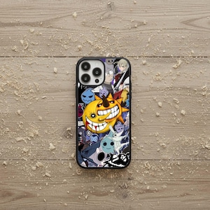 May include: Black phone case with a colorful anime-style design. The case features a smiling yellow sun character with a large grin, surrounded by other cartoon characters in various colors. The case has a black border and a glossy finish.