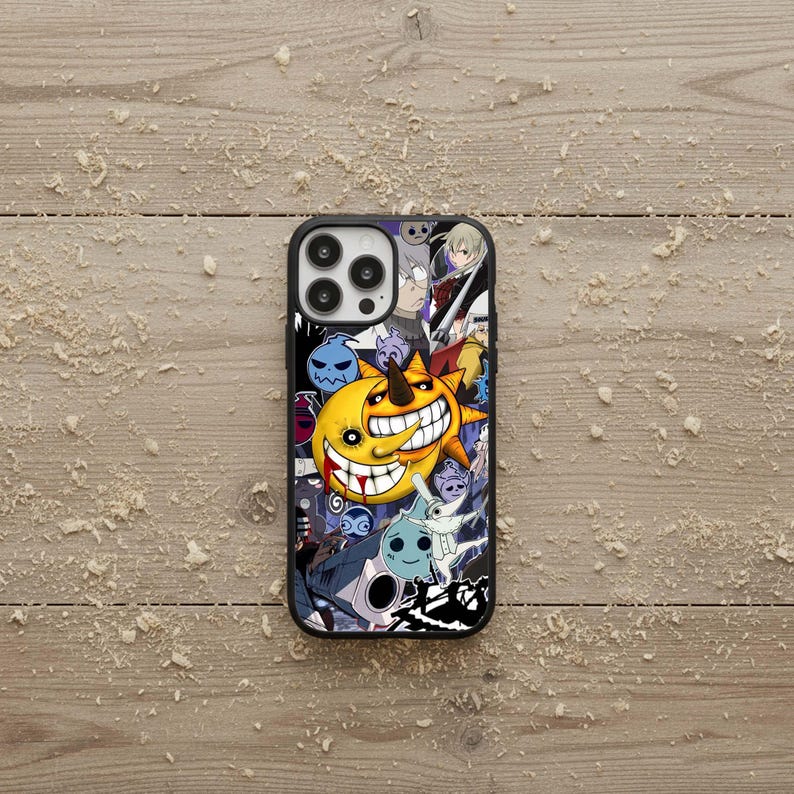 May include: Black phone case with a colorful anime-style design. The case features a smiling yellow sun character with a large grin, surrounded by other cartoon characters in various colors. The case has a black border and a glossy finish.