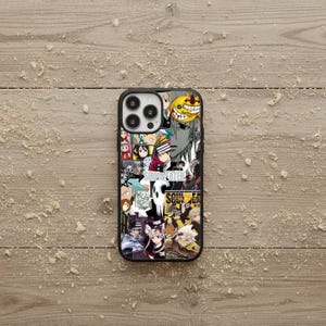 May include: Black phone case featuring a collage of anime characters and the text "SOUL EATER". The case has a black border and a glossy finish. The design includes various characters in vibrant colors.
