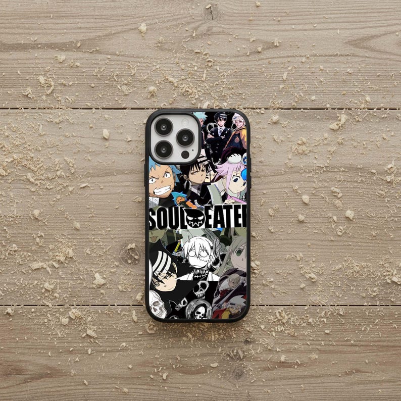 May include: Black phone case featuring a collage of anime characters and the text "SOUL EATER" in white. The case has a glossy finish and a black border, with a multi-lens camera cutout.
