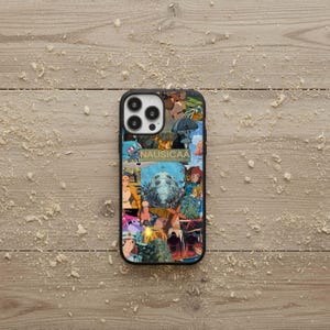 May include: Black phone case featuring a collage of colorful anime-style illustrations. The word "NAUSICAA" is printed on the case. The case has a black border and a glossy finish.