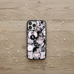 May include: Black and white phone case featuring anime-style illustrations. The case has a black border and a design with multiple character portraits and speech bubbles. The overall theme is manga and anime.