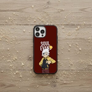 May include: A burgundy phone case featuring a cartoon character in a yellow jacket and the text "SOUL EVANS". The case has a black border and a camera cutout.