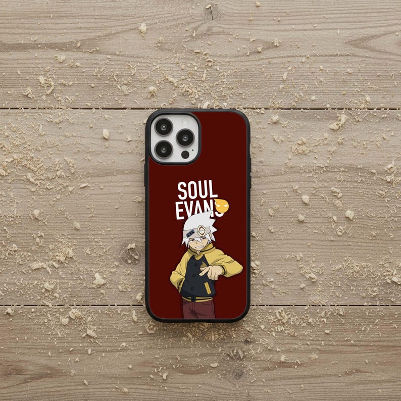 May include: A burgundy phone case featuring a cartoon character in a yellow jacket and the text "SOUL EVANS". The case has a black border and a camera cutout.