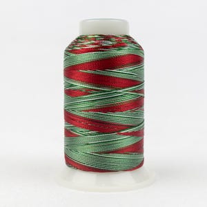 May include: A spool of embroidery thread featuring a variegated pattern of shiny red, metallic green, and white strands wound tightly around a white plastic cylinder with a flat base and a rounded top cap for secure storage and easy dispensing.