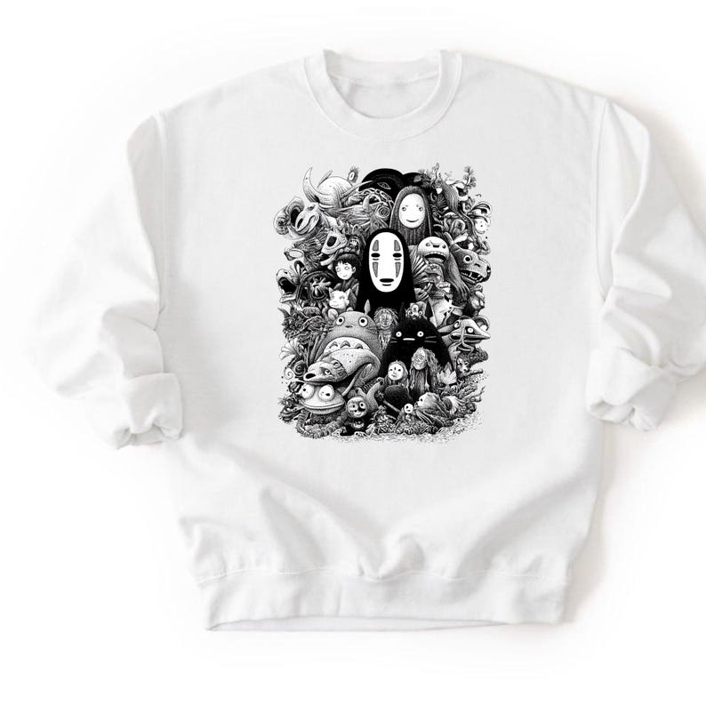 May include: White crewneck sweatshirt featuring a black and white graphic of various animated characters. The design includes faces and figures from a popular animated film. The sweatshirt has long sleeves and a classic fit.