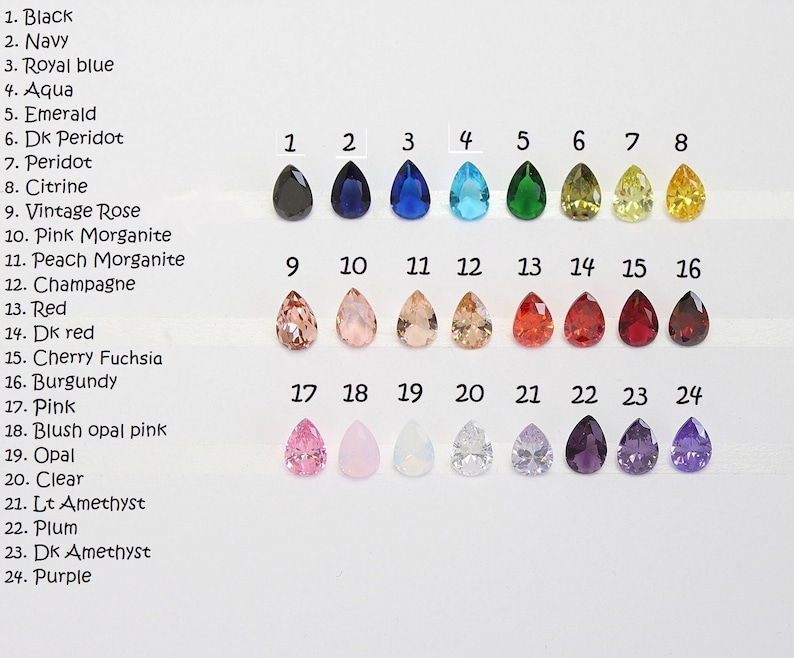 May include: Chart of 24 teardrop-shaped gemstones in various colors, numbered 1 through 24. The colors include black, navy, royal blue, aqua, emerald, peridot, citrine, vintage rose, pink morganite, peach morganite, champagne, red, dark red, cherry fuchsia, burgundy, pink, blush opal pink, opal, clear, light amethyst, plum, dark amethyst, and purple.