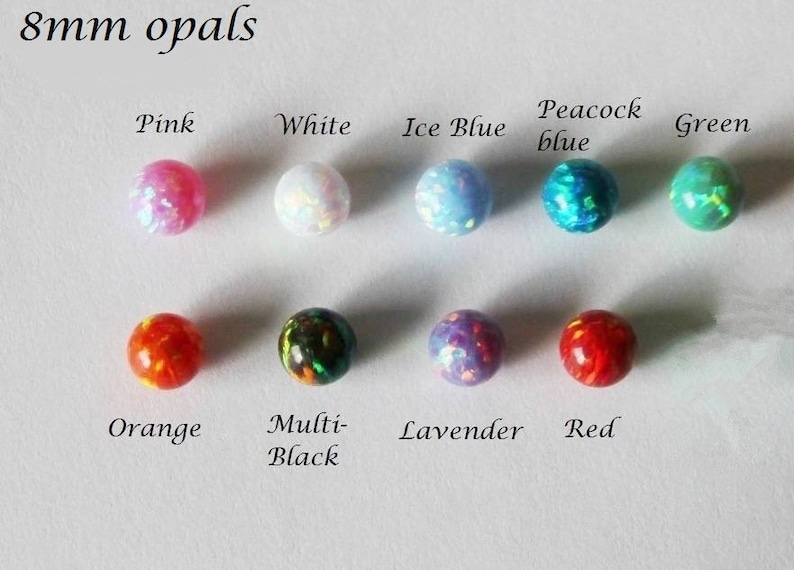 May include: Eight 8mm opal beads in various colors, including pink, white, ice blue, peacock blue, green, orange, multi-black, lavender, and red.