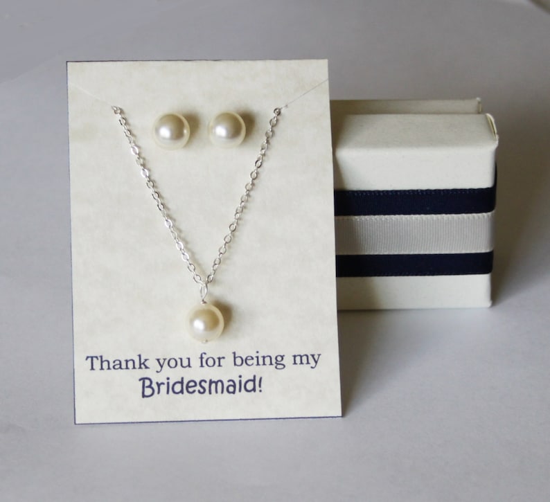 May include: A white card with a silver necklace and pearl earrings. The card says "Thank you for being my Bridesmaid!"