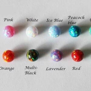 May include: Assortment of 10 opalite beads in various colors, including pink, white, ice blue, peacock blue, green, orange, multi-black, lavender, and red.