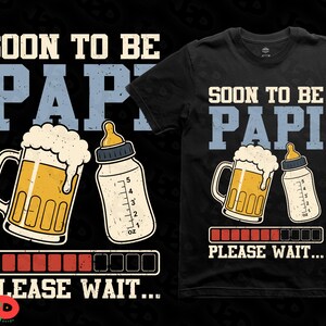 May include: Black t-shirt featuring the words "SOON TO BE PAPI" in white and blue. The design includes a beer mug, a baby bottle, and a loading bar graphic. The text "PLEASE WAIT..." is below the loading bar.