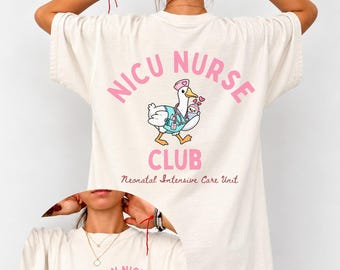 May include: An ivory t-shirt featuring a graphic on the back with the text NICU NURSE CLUB and Neonatal Intensive Care Unit, showing a cartoon goose wearing a nurse hat and scrubs holding a baby. The front has the text RN NICU CLUB est. 2026.