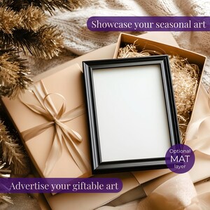 May include: A black framed picture frame with a white mat, resting on a beige gift box with a satin ribbon. The image is surrounded by a gold-colored decorative element and text that reads "Showcase your seasonal art" and "Advertise your giftable art."
