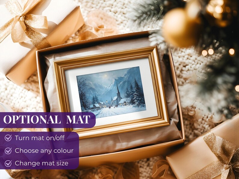 May include: A framed winter landscape painting with a gold frame, presented in a gift box. The painting depicts a snow-covered village with a church and mountains in the background. The box is surrounded by wrapped gifts.