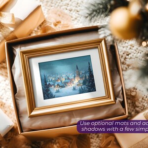 May include: A framed winter landscape painting with a gold frame, presented in a gift box with a gold bow. The painting depicts a snow-covered village with a church steeple. The text in the image reads: "Use optional mats and adjustable shadows with a few simple clicks."