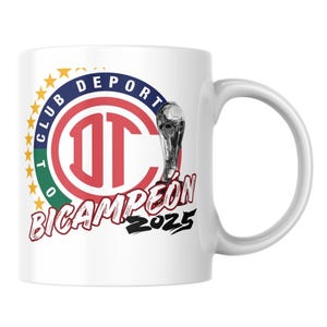 May include: White ceramic mug featuring the words "CLUB DEPORTIVO TOLUCA" and "BICAMPEÓN 2025". The mug has a red and white logo with a soccer trophy graphic.