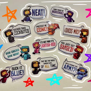May include: A collection of stickers with cartoon characters in various colors, each with a speech bubble containing text. Phrases include "NEAT!", "Bow Chicka Bow Wow!", and "Who is running this army?" Colorful stars surround the stickers.