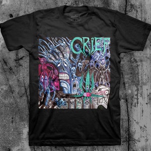 May include: Black t-shirt with a graphic print of a band called "Grief". The graphic is a colorful, surreal illustration of a tree with faces and other creatures.
