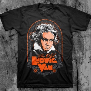 May include: Black t-shirt with an orange graphic of a man's face and the text "The Old Ludwig Van". The graphic is surrounded by gears and musical notes.