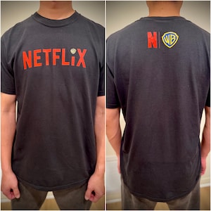 Camiseta de adquisición de Netflix y Warner Bros.