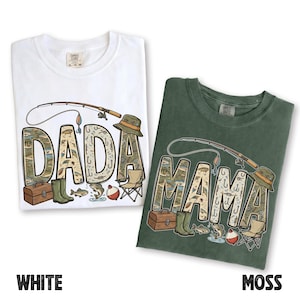 May include: Two t-shirts, one white and one moss green, with fishing-themed designs. The white shirt says "DADA" and the green shirt says "MAMA", both with fishing rod, hat, and fish graphics. The word "WHITE" and "MOSS" are at the bottom.