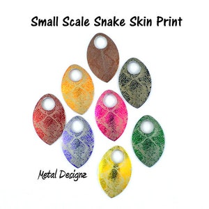 May include: Oval-shaped metal pendants with a small-scale snakeskin print in various colors, including red, yellow, pink, blue, and green. Each pendant has a hole at the top. The text "Small Scale Snake Skin Print" and "Metal Designz" are visible.