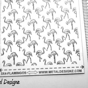 May include: A sheet of metal with a repeating pattern of black and white flamingo silhouettes. The sheet is 3 inches by 4 inches and has the text "3x4-FLAMINGOS" and "WWW.METALDESIGNZ.COM" printed on it.
