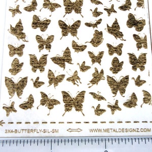 May include: A sheet of 3x4 butterfly silhouette stickers in a gold metallic finish. The sheet is labeled "3x4-BUTTERFLY-SIL-SM" and "WWW.METALDESIGNZ.COM".