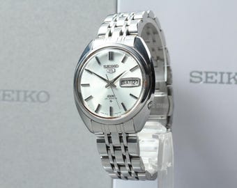 Vintage SEIKO 5 DX 6106-7000 (Exc+5) date automatic 35mm Men's Silver watch