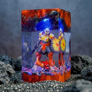 May include: A set of three ceramic mugs with a speckled, matte finish. The mugs are in shades of cream, light grey, and dark grey. Each mug has a simple, minimalist design, ideal for coffee or tea.