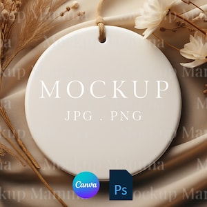 May include: A round, off-white ceramic mockup with the word "MOCKUP" in the center, along with "JPG . PNG". A natural twine loop is at the top. The background includes dried flowers and a soft, neutral-toned fabric.