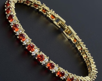 RIZILIA - Birthstone JAN-Red Garnet Tennis Bracelet & Round Cut CZ in Yellow/White Gold Plated, 7"