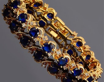 RIZILIA BLOSSOM September Birthstone Tennis Bracelet • Blue Sapphire CZ • 18K Gold/White Gold • 7"