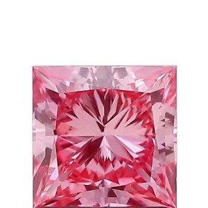 May include: A square-cut, pink gemstone with a brilliant, faceted surface. The gem's colour transitions from a lighter pink to a deeper, more saturated hue in the centre. The facets create a play of light and shadow.