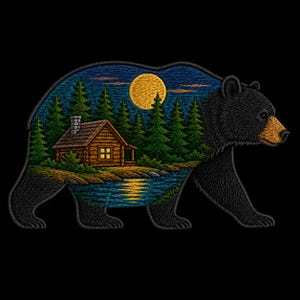 May include: An embroidered patch shaped like a black bear, featuring a detailed landscape inside its silhouette. The scene depicts a log cabin by a river, surrounded by green pine trees under a large yellow full moon against a dark blue sky.