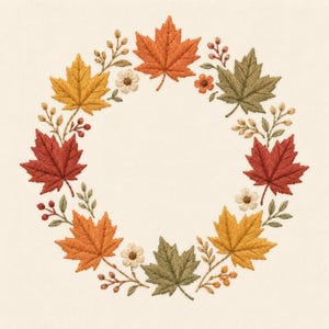 Pode incluir: Um design de bordado apresentando uma guirlanda circular de folhas de bordo de outono em tons de laranja, vermelho, amarelo e verde, intercaladas com pequenas flores brancas e delicados ramos de bagas sobre um fundo de tecido branco sujo.