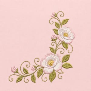 May include: An embroidery design featuring two large white flowers with pink-edged petals and yellow centers, accompanied by three small pink flower buds, olive green leaves, and swirling vine stems, all set against a solid light pink background.