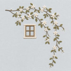 May include: An embroidery design on light blue fabric featuring a small, square, brown-framed window with a cream border. A trailing vine with olive green leaves and small, five-petaled white flowers arches over and down the side of the window.