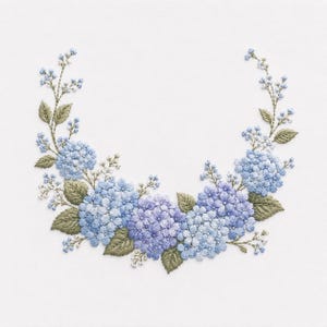 May include: Embroidered floral wreath featuring blue and purple hydrangeas, green leaves, and delicate white accents. The design is set against a white background, showcasing the detailed stitching and color variations. A decorative piece for home decor.